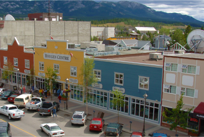 Yukon street with colourful buildings and cars