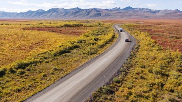 Cars driving along the dempster highway