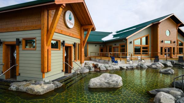 Eclipse Hot Springs buildings surrounded by rocks and water of the springs