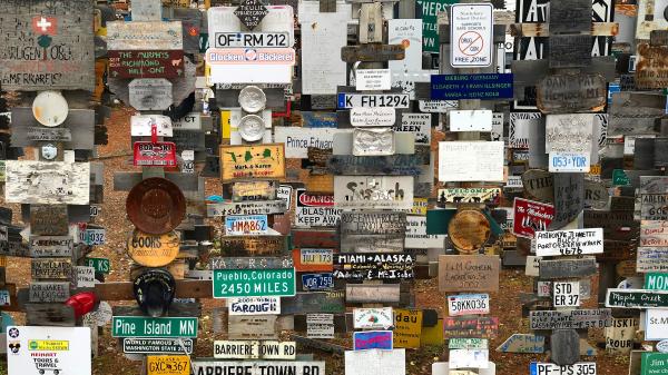 A collection of road and business signs 