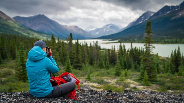 A person enjoys the view overlooking Primrose Lake