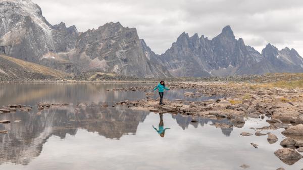 A woman hiker at Talus Lake in Tombstone Territorial Park, Yukon