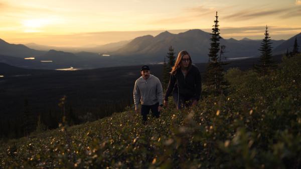 two people on a mountainside on summer solstice