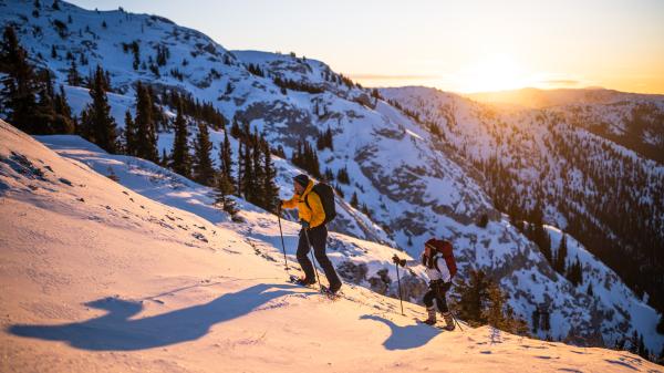 Hiking up Mount White on snowshoes at sunrise.