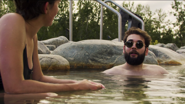 Customers relaxing in hot springs pool at Eclipse Nordic Hot Springs.