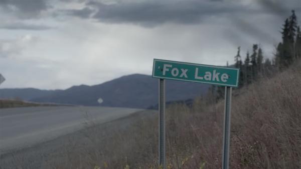 Sign post of Fox Lake along the highway