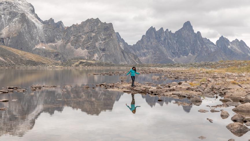 A woman hiker at Talus Lake in Tombstone Territorial Park, Yukon