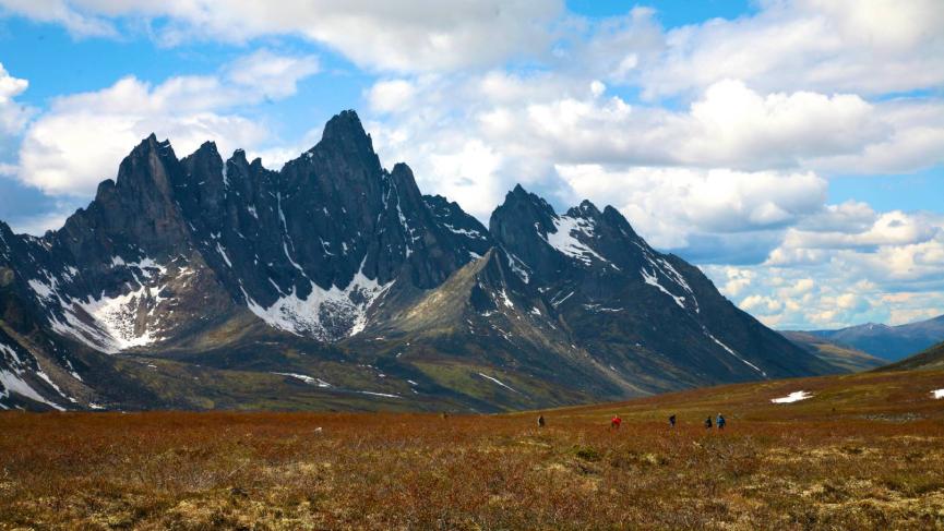 Tombstone Territorial Park mountains stand tall against the red and orange brush of fall