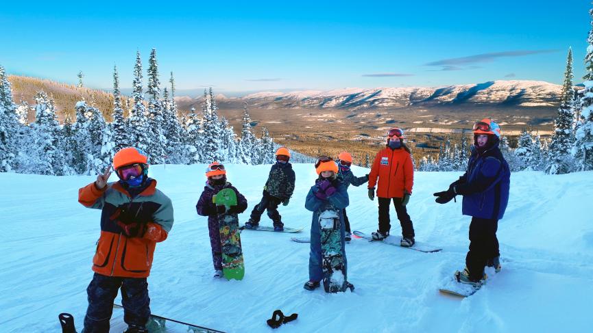 kids in snowboard camp with instructor
