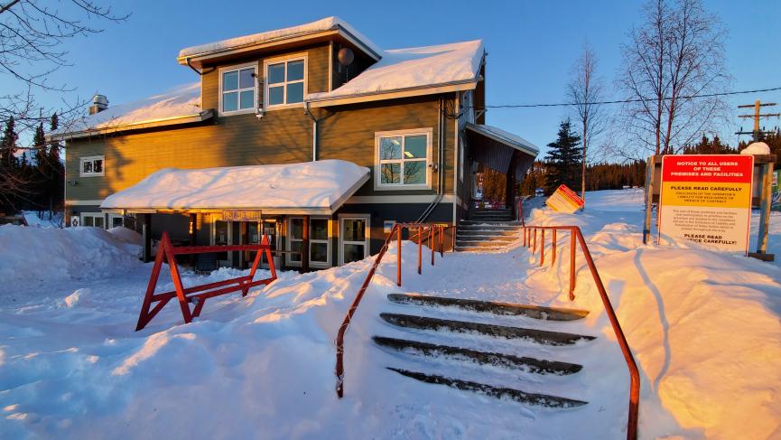 front of lodge at sunrise