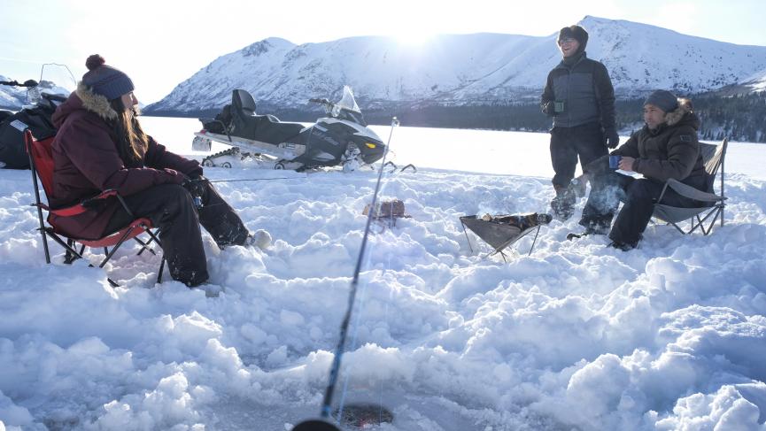 Winter ice fishing tour on Yukon lake.