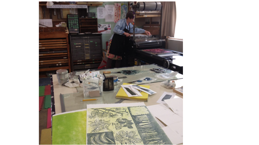 Artist Martha Ritchie works with the Vandercook press