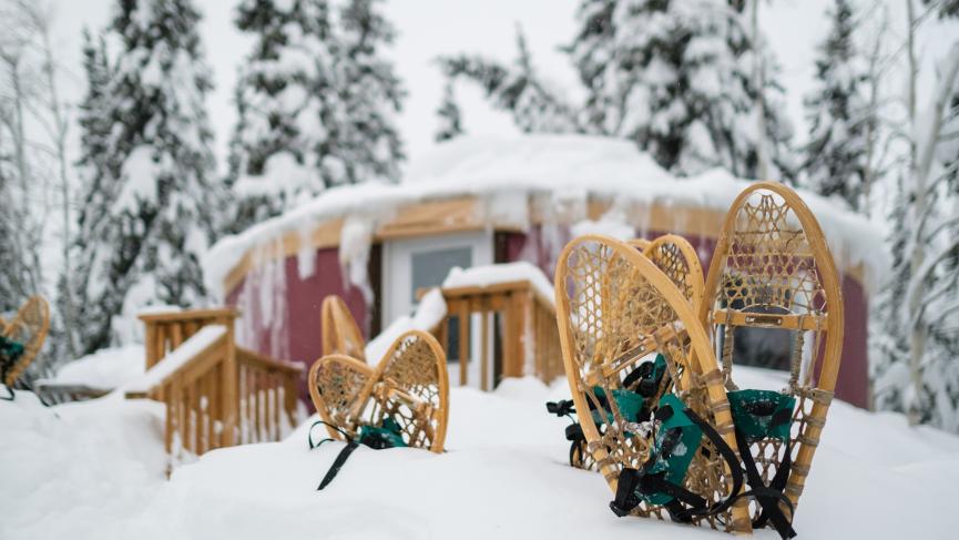 Snowshoes stuck in deep snow outside of lodge
