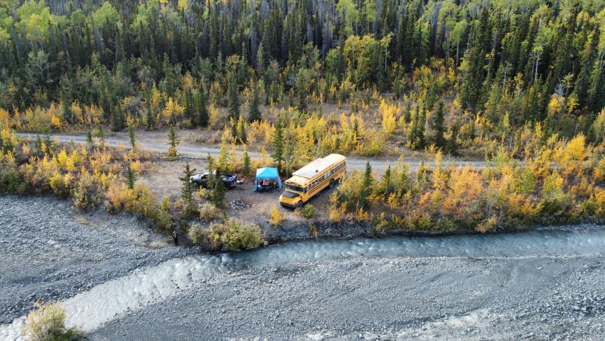 Squatch bus camped in the Yukon wilderness