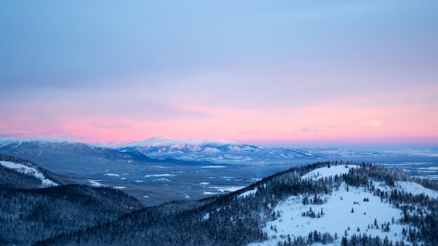 View of mountains in the Yukon with pink skies