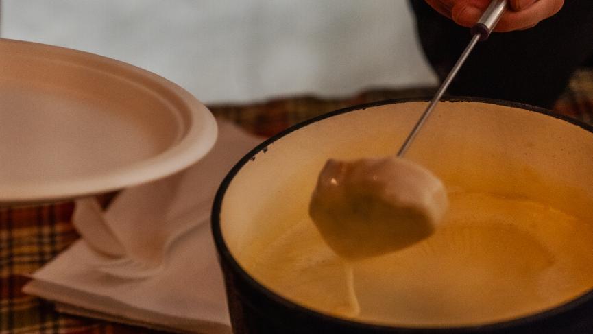 Warming Swiss cheese fondue