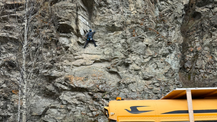 Rock climbing near Dawson City with the Squatch bus at the crag