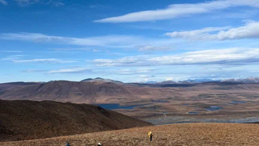 Hiking on tundra Vines Mountain Tombstone in autumn