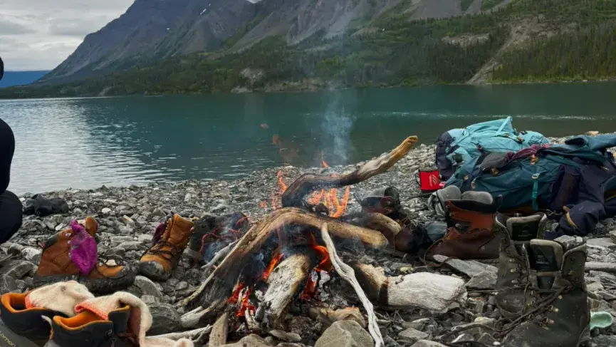 Setting up camp in the wild on the side of the lake