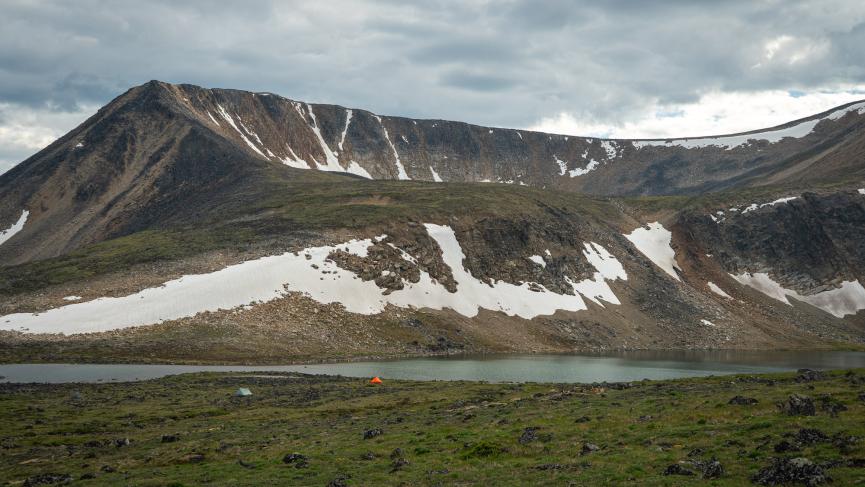 Tents by alpine lake