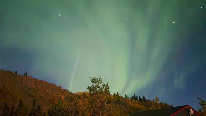 Aurora over wagons in fall