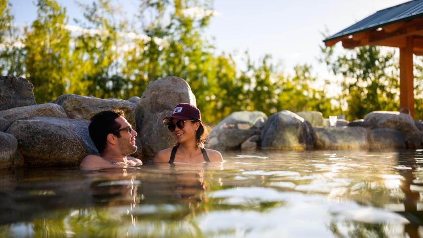 A couple soaking in Eclipse Pool at Eclipse Nordic Hot Springs