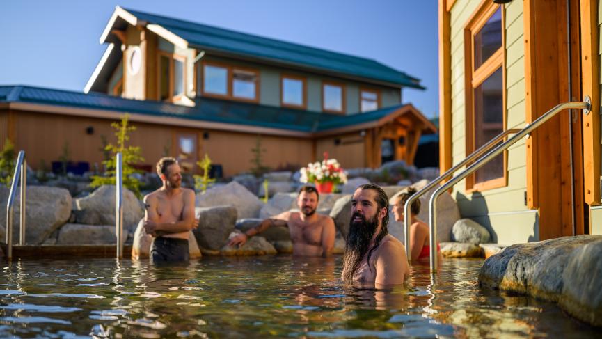Customers relaxing in hot springs pool at Eclipse Nordic Hot Springs.