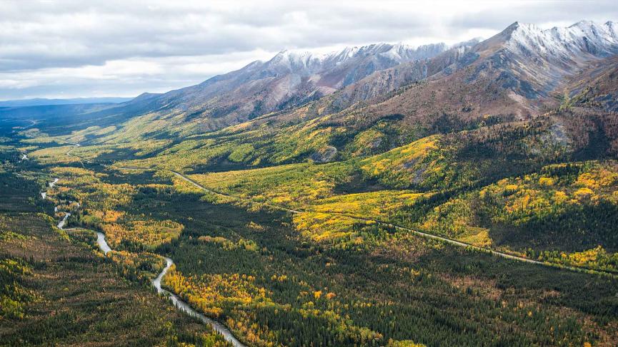 A river valley among autumn colours in northern Yukon.