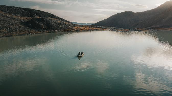 Packrafting near paddy peak