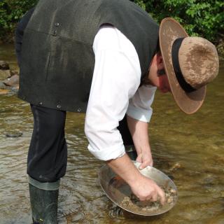 A person panning for gold in Free Claim #6 in Dawson City