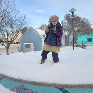 Tour guide and artist Nicole Bauberger tells animated stories on Chris Scherbarth's gorgeous mosaic stage in LePage Park