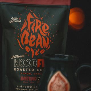 A bag of Firebean Coffee with a Fireglow in the background