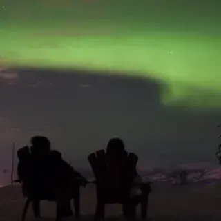 Northern lights above Whitehorse from top of Mount Sima
