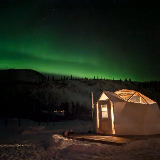 northern lights in winter over dome