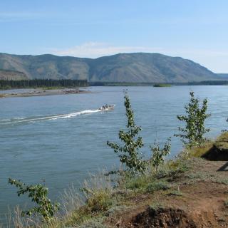 A boat jets along the Yukon River