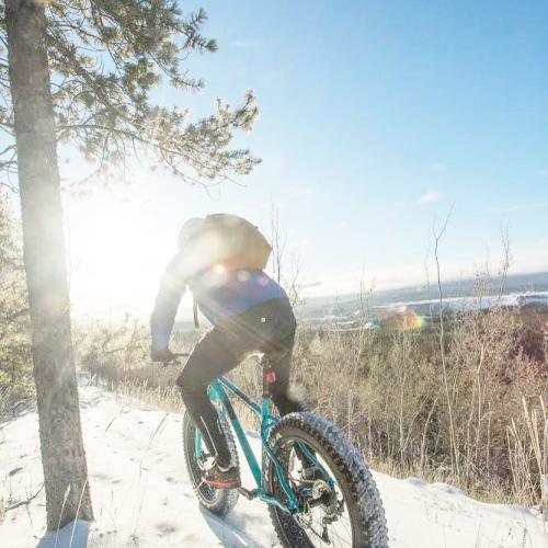 A person fatbiking along a mountain ridge
