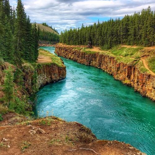 A view of the teal water of Miles Canyon