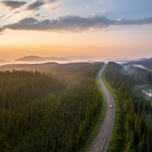 Alaska highway under midnight sun
