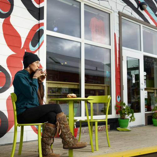 margareta sipping coffee in the carcross commons