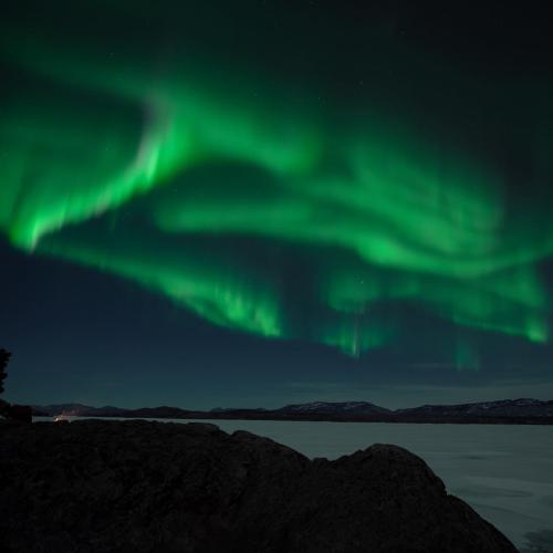 Northern lights above a lake