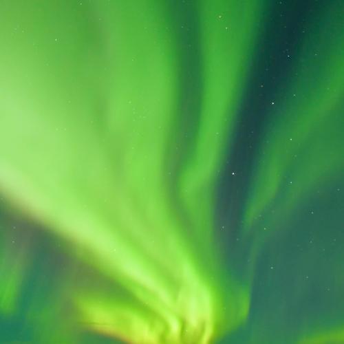 Aurora over the Richardson Mountains at the Arctic Circle crossing along the Dempster HW in the Yukon Territory, Canada