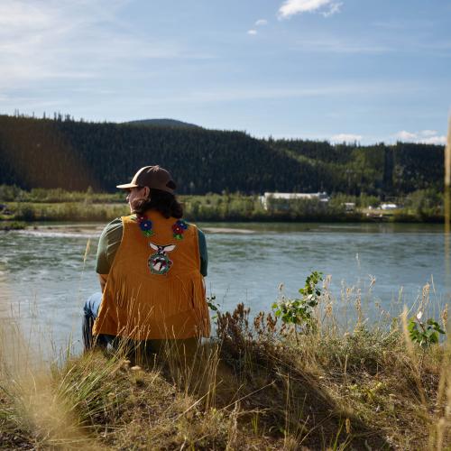 A LSC citizen stands on the Yukon River bank in Carmacks Yukon
