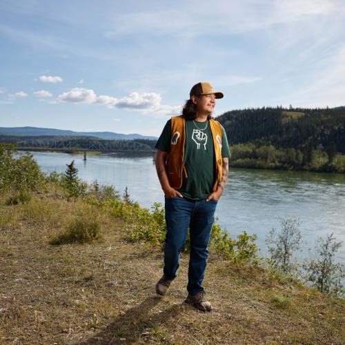 A LSC citizen stands on the Yukon River bank in Carmacks Yukon