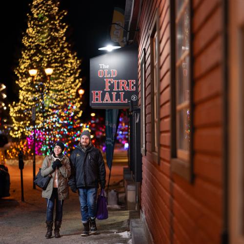 Two people Christmas shopping on Main Street
