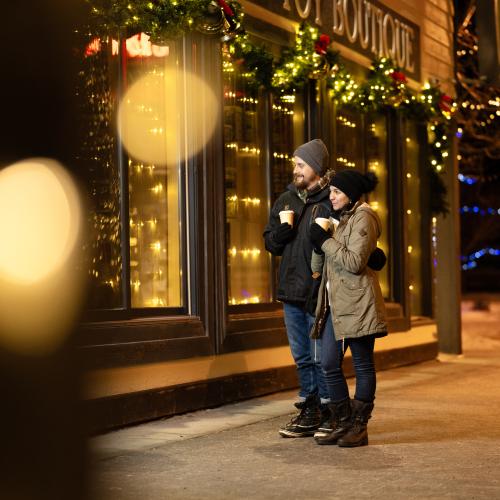Two people Christmas shopping on Main Street