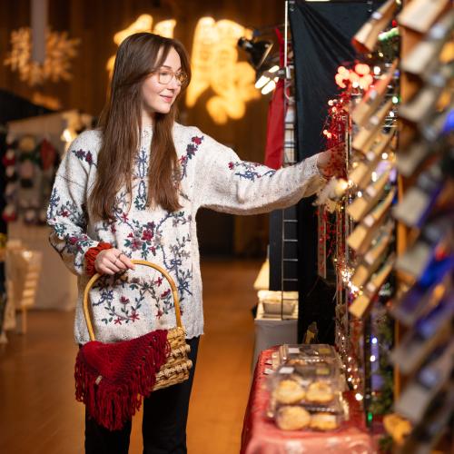 A person shopping at 12 Days of Christmas Market