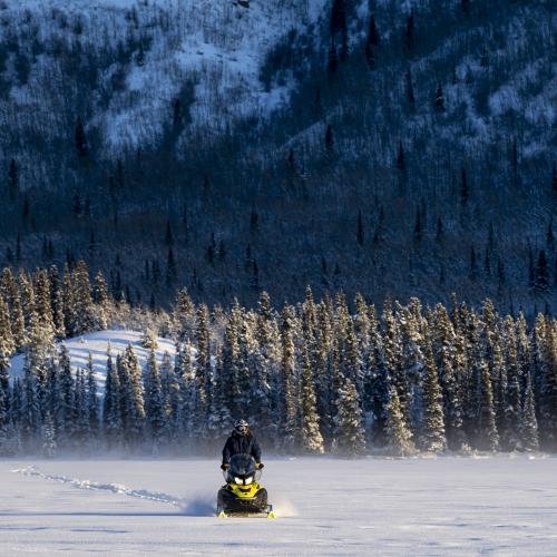 Snowmobiling on a frozen lake. 