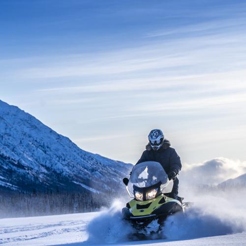 Snowmobiling on a frozen lake. 