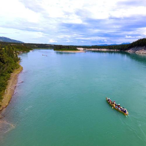Paddlers passing by egg island at the start of the river quest.