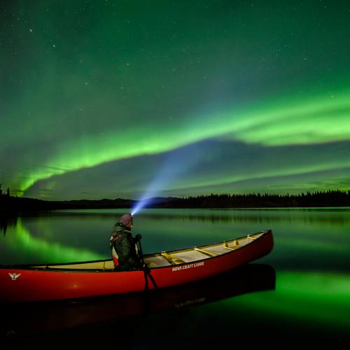 A-paddler-in-canoe-looking-at-auroras